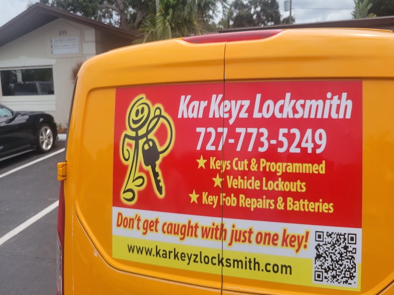 The Kar Keyz service van in parking lot at the store.